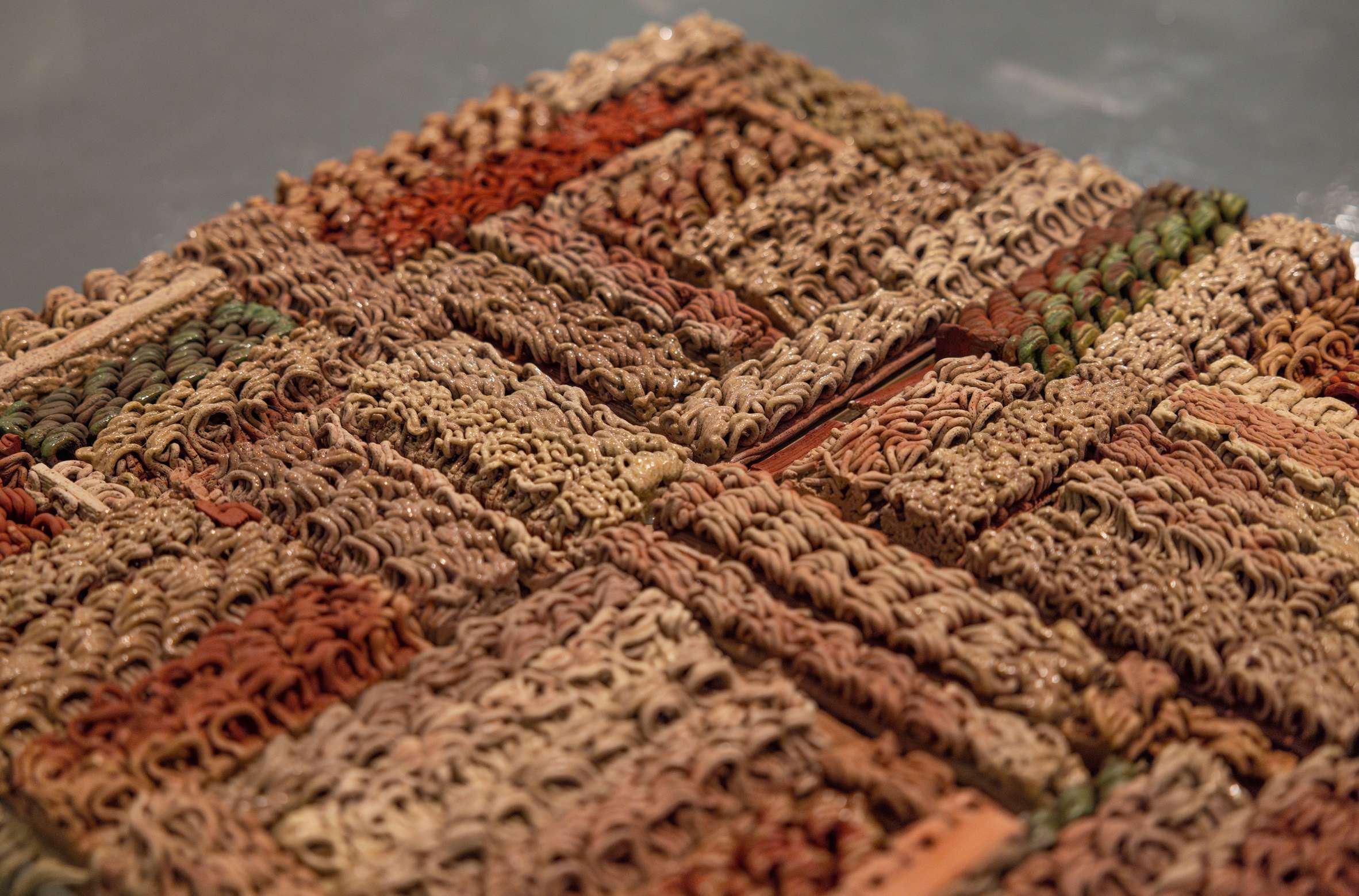 Close view of a modular ceramic field with patterned printed lines